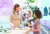 A customer purchasing a scarf with her credit card at a boutique.